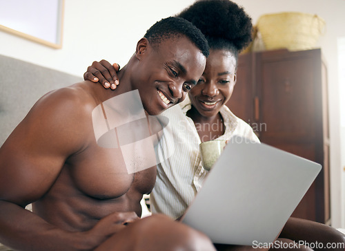 Image of One episode to start the day. a young couple using a laptop together at home.