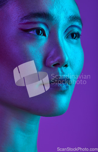 Image of Have that beauty hangover. an attractive young woman posing in studio against a purple background.