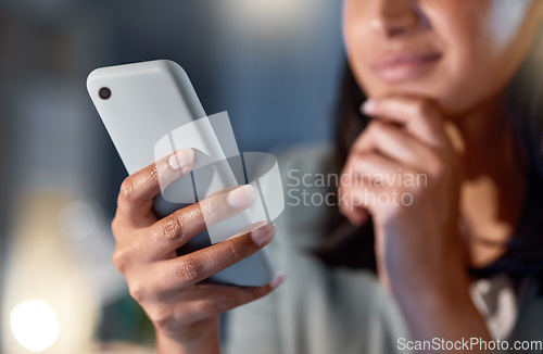 Image of Shes easily reachable. an unrecognizable businesswoman working late at her company offices.