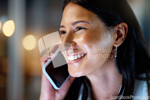 Image of Always on call. an attractive young businesswoman working late at her company offices.