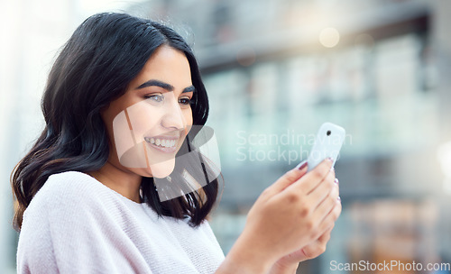 Image of Connect with more contacts, collect more opportunities. a young businesswoman using a smartphone against an urban background.