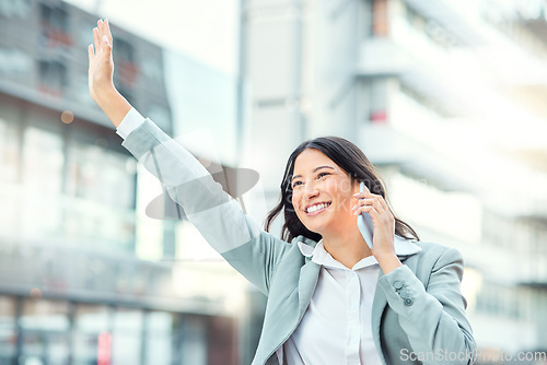 Image of Build the tomorrow you deserve with the opportunities of today. a young businesswoman using a smartphone and gesturing to order a cab against an urban background.