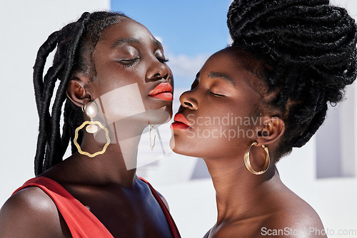 Image of Summer beauty. two attractive young women posing on a rooftop outdoors.