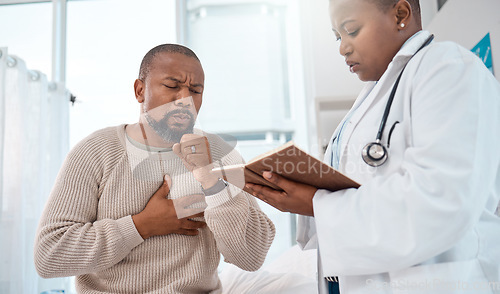 Image of Sounds like you have an infection. a mature man coughing during a consultation with a doctor in a clinic.