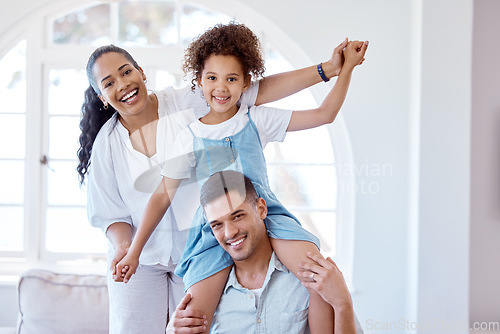 Image of Fun is vital in our family. Portrait of a little girl bonding with her parents at home.