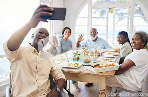 Image of Family meals provide an opportunity for family to come together. a family taking a selfie while having lunch at home.