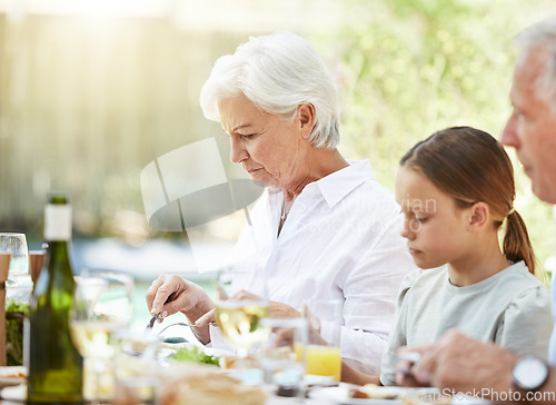 Image of The only time when everyone is quiet...a family enjoying a meal together at home.