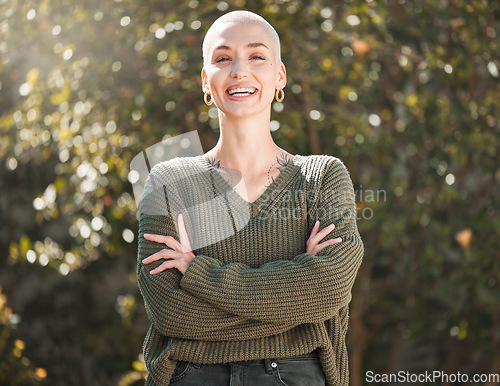 Image of Be your own reason to smile. Cropped portrait of an attractive young woman standing with her arms folded outdoors.