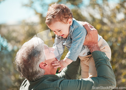 Image of Whos my special boy. a handsome mature man and his grandson outdoors.