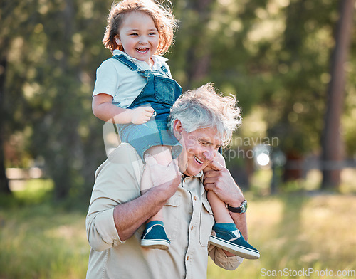 Image of Grandpa has the best stories and the best adventures. a senior man carrying his grandson on his shoulders.