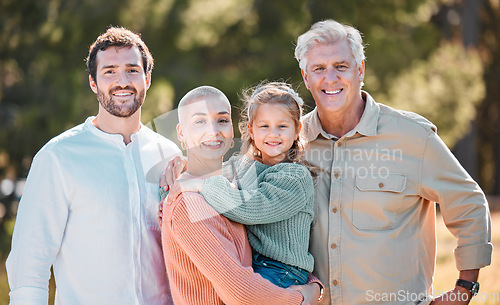 Image of If youre part of a family, youre part of something great. a multi-generational family posing together outdoors.