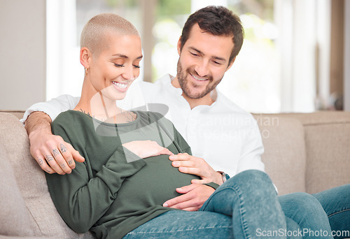 Image of We cant wait any longer. an affectionate young expectant couple sitting on the sofa at home.