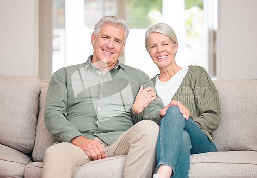 Image of Were loving our retirement. Cropped portrait of an affectionate senior couple sitting on the sofa at home.