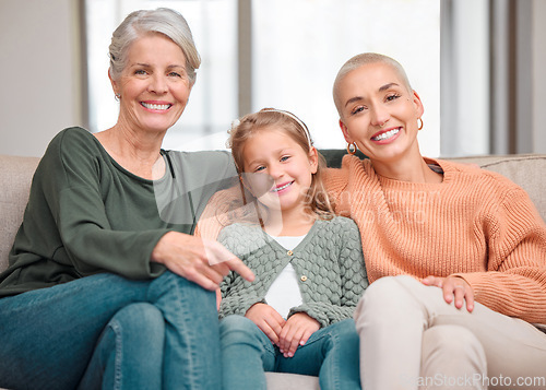 Image of The ultimate girl time. Portrait of a mature woman bonding with her daughter and granddaughter on the sofa at home.