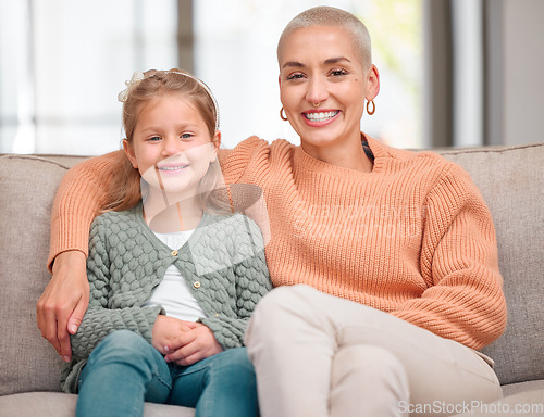 Image of The coolest mom. Portrait of a daughter and mother bonding on the sofa together at home.