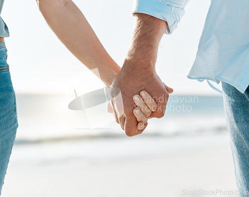 Image of Together is my favourite word. a mature couple holding hands on the beach.