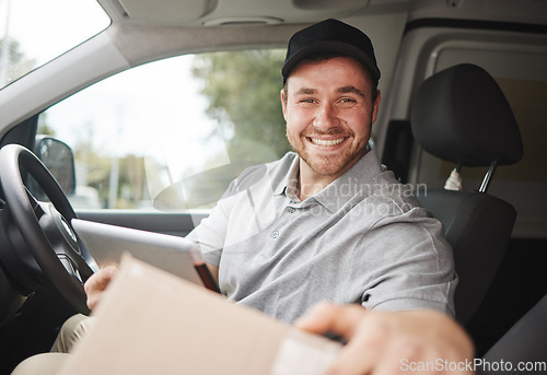 Image of Ill have this delivered in no time. Cropped portrait of a handsome young delivery man using a tablet while sitting in his van.