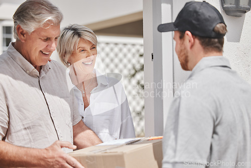 Image of That was quick. a handsome young male courier delivering a package to a senior couple at their home.