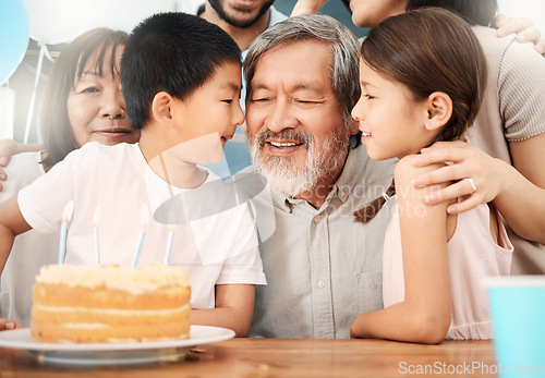 Image of The old believe everything. a happy family celebrating a birthday at home.