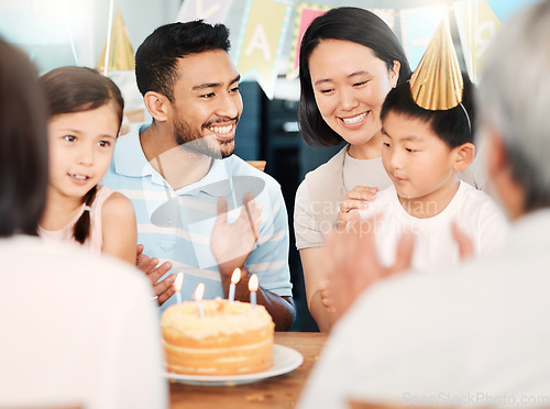 Image of Age is a case of mind over matter. a happy family celebrating a birthday at home.