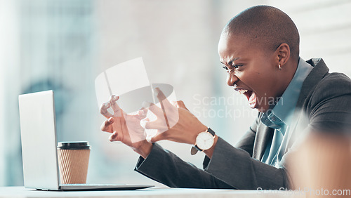 Image of Stop deleting my work. an attractive young businesswoman sitting alone in the office and feeling angry while using her laptop.