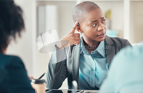 Image of This concerns me a little bit. an attractive young businesswoman sitting and looking concerned during a meeting in the office.