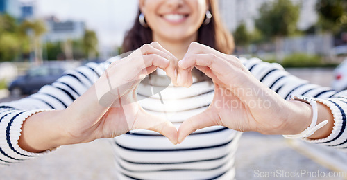 Image of Your heart dont stand a chance. an unrecognisable businesswoman making a heart shaped gesture with her hands outside.