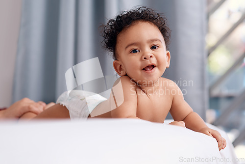 Image of I mean, have you ever seen anyone cuter. an adorable baby boy on the bed at home.