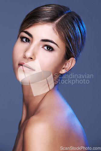 Image of Luminous beauty. A cropped portrait of a beautiful young woman isolated on grey.
