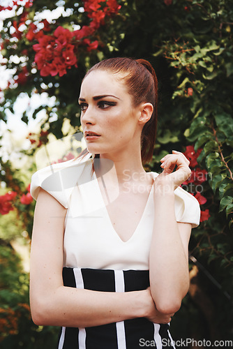 Image of Fashion in the great outdoors. an attracttive and fashionable young woman posing in the midst of nature.