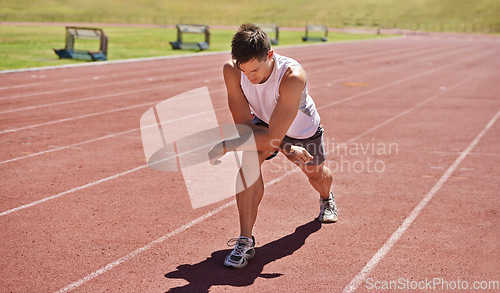 Image of Getting into the zone. a runner preparing for his event.