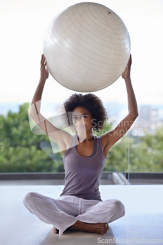 Image of You should really try this...Full-length portrait of an attractive young woman holding up an exercise ball.