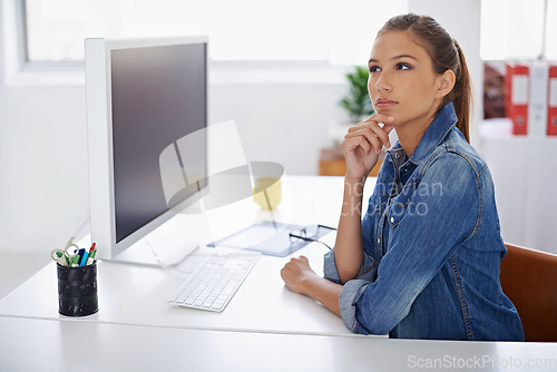 Image of Successful people are those who are good at plan B. a young sitting thoughtfully at her desk.