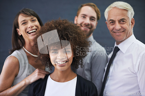 Image of Corporate compatibility. Portrait of a group of happy coworkers standing together.