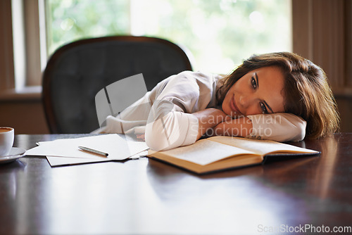 Image of Writing makes me sleepy. Portrait of an attractive young woman enjoying a break from writing.