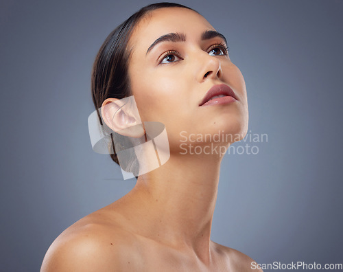 Image of Start taking proper care of your skin. Studio shot of a beautiful young woman posing against a grey background.