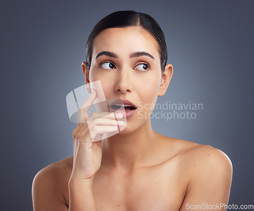 Image of Theres a new favourite skincare product in town. Studio shot of a beautiful young woman posing against a grey background.