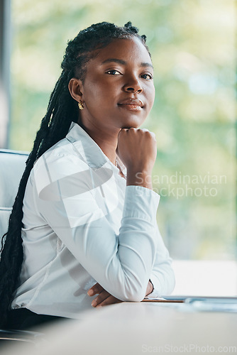 Image of Im here to fulfil my career goals. Cropped portrait of an attractive young businesswoman sitting at her desk in the office.