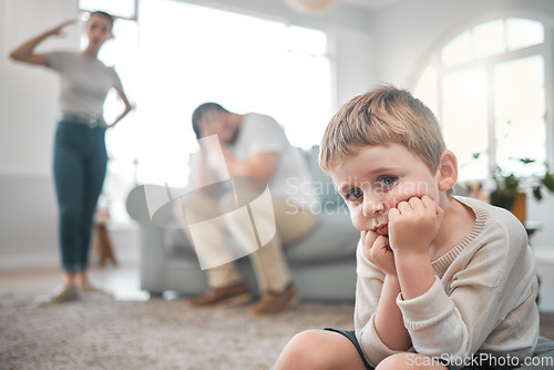 Image of A persons a person, no matter how small. a little boy looking sad while his parent argue at home.