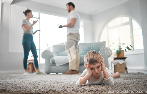 Image of Children are taught how to think, not what to think. a little boy looking sad while his parent argue at home.