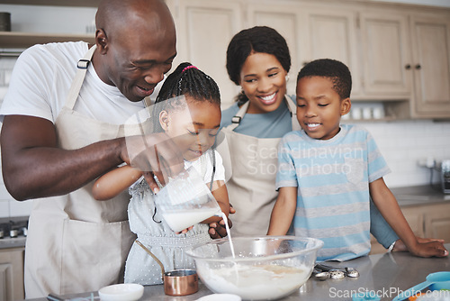 Image of A bond everyone strives for. a family baking together in the kitchen.