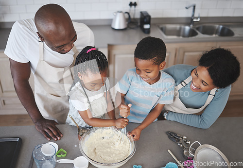 Image of The measuring and mixing always smoothed out her thinking processes. a family baking together in the kitchen.