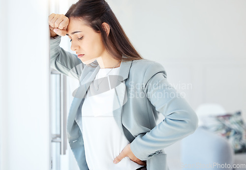 Image of You are stronger than your challenges. a young businesswoman looking overwhelmed in an office at work.