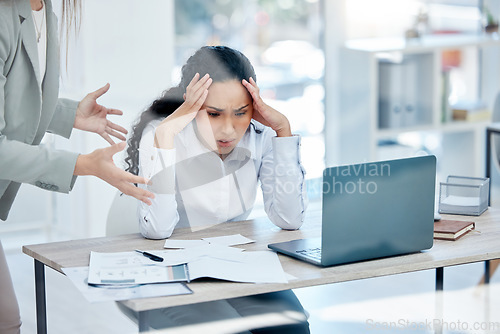 Image of Theres too much going on. a young businesswoman feeling overwhelmed in a demanding work environment.