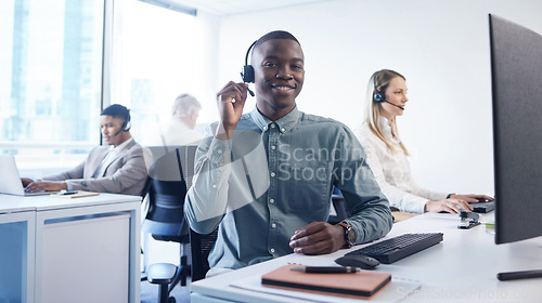 Image of Customer service is the heartbeat of your brand. Portrait of a young businessman using a headset and computer in a modern office.