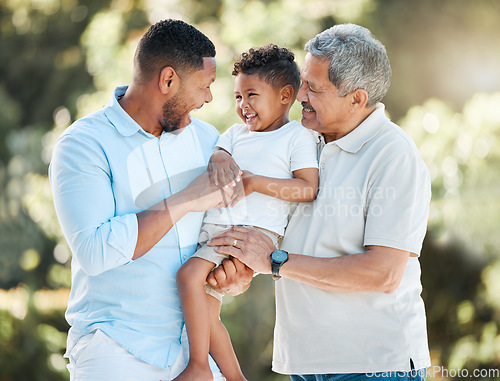 Image of I want him to experience the same love I received from my father. a little boy posing outside with his father and grandfather.