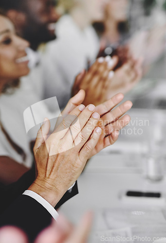 Image of One team, one goal. a group of businesspeople applauding a business presentation.