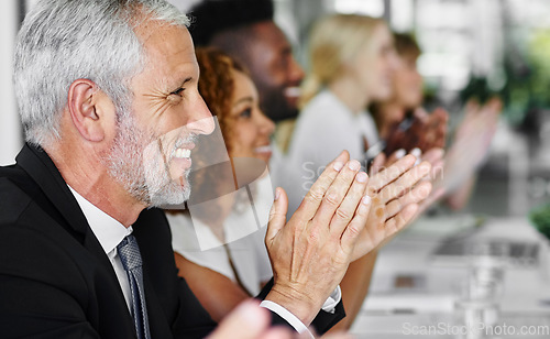 Image of Were ready for another success story. a group of businesspeople applauding a business presentation.