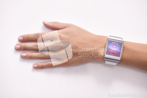 Image of Smart technology. Closeup studio shot of a womans arm wearing a smartwatch - All screen content is designed by us and not copyrighted by others.