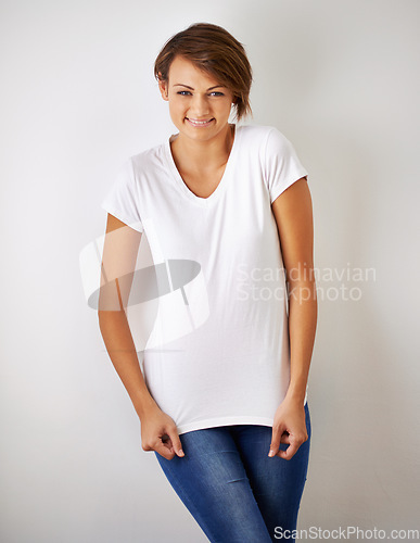 Image of Shes got spunk. A cropped portrait of a beautiful young woman in jeans and a t shirt.